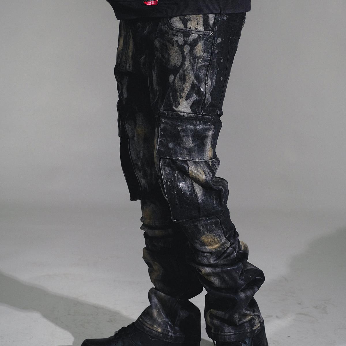 Wax coated washed flared denim pant