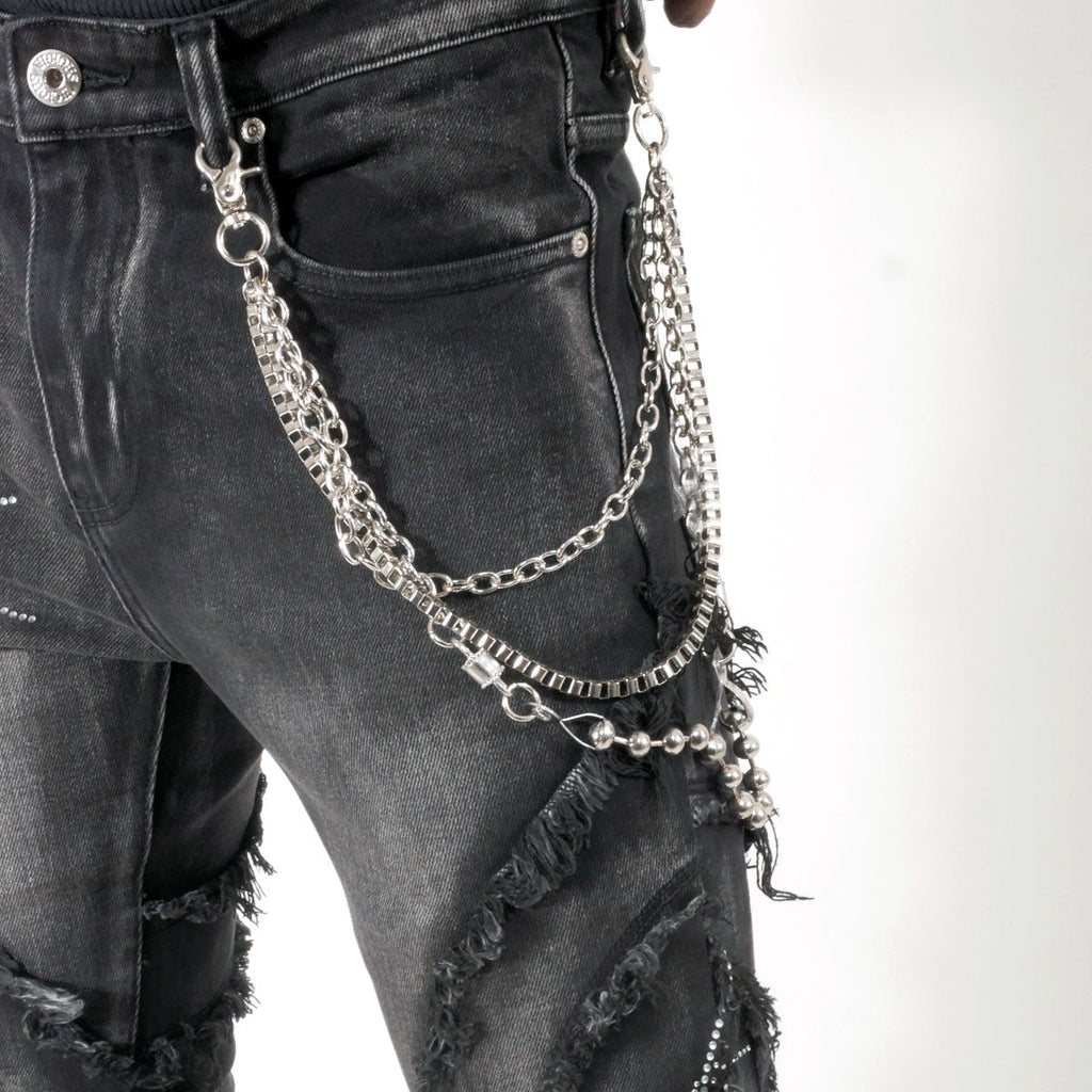 Stack denim pant w/ studded spider webs